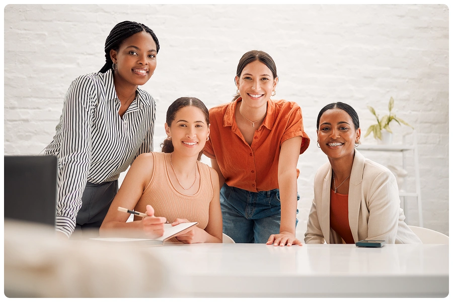 Diverse women collaborating in office