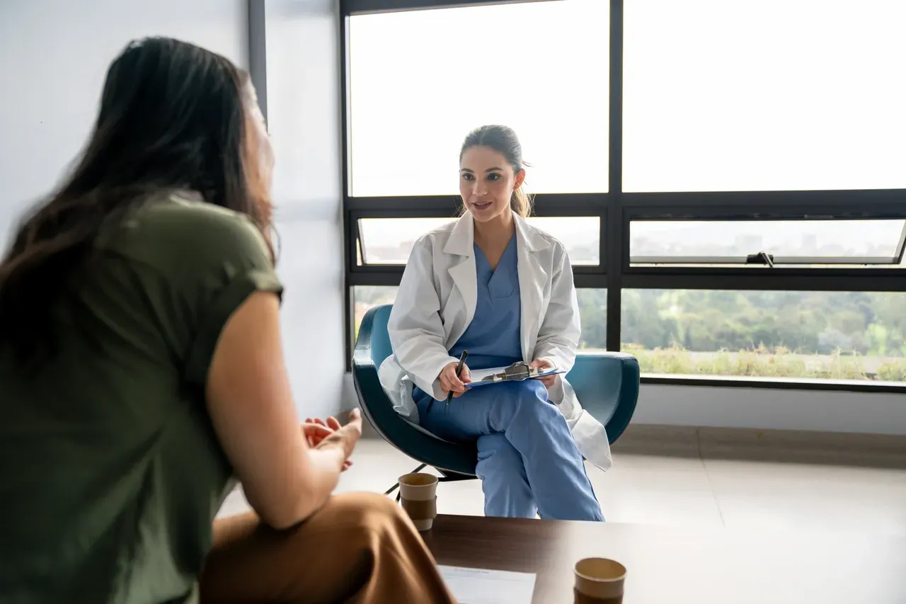 Doctor consulting with patient in office