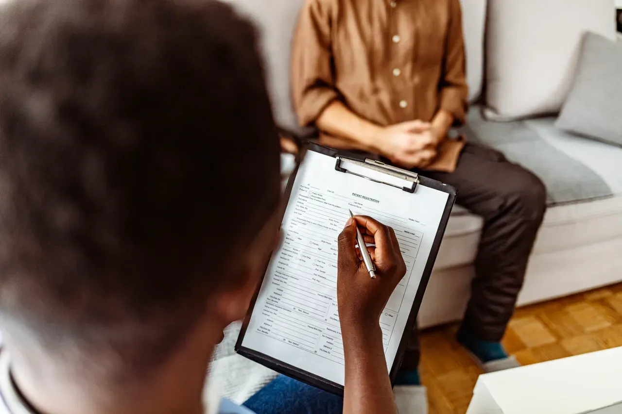 Counseling session with clipboard